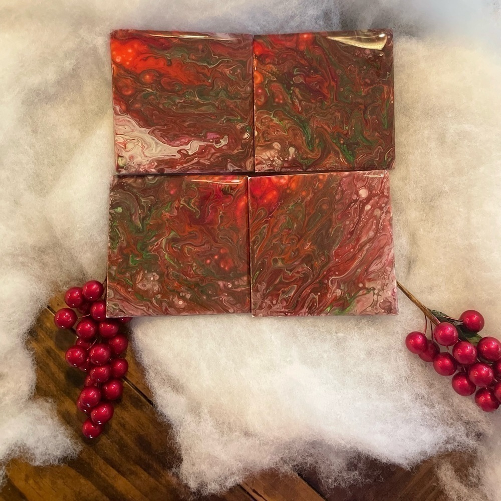Set of 4 hand painted coasters. Sealed with resin cork backing Red & greens